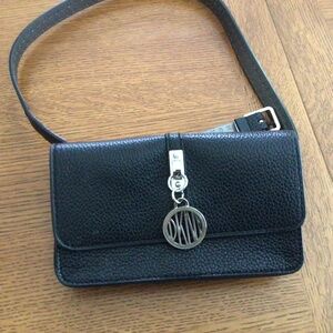 DKNY small fanny phone pack with adjustable belting.  EUC, used once.
